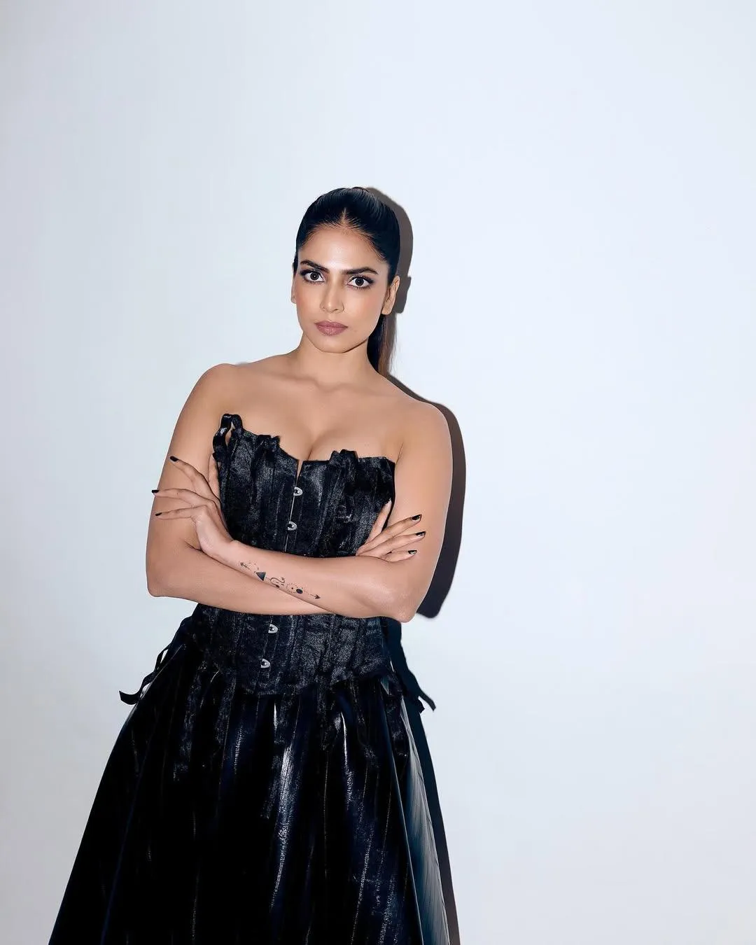 Black Dress Photoshoot Pose by Malavika Mohanan Looks Chic