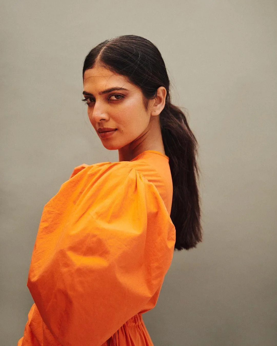 Bright Orange Dress Worn by Malavika Mohanan Stands Out