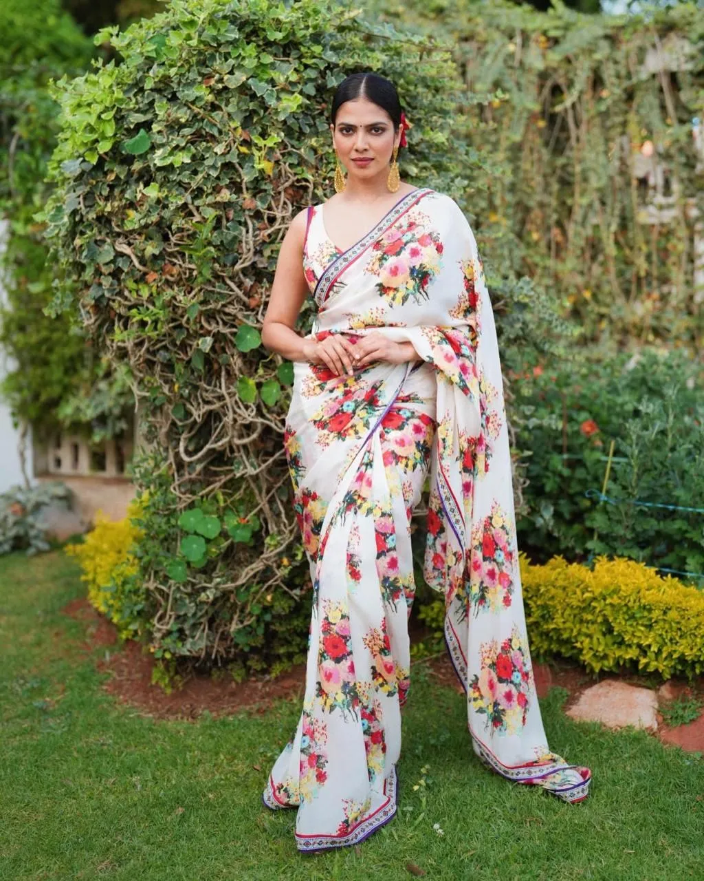 Charming Malavika Mohanan Graceful Pose in Floral Saree