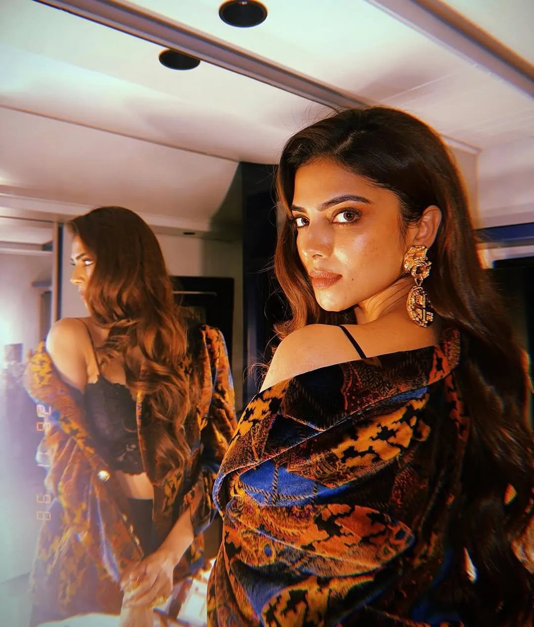 Charming Malavika Mohanan in Black Outfit with Mirror Pose