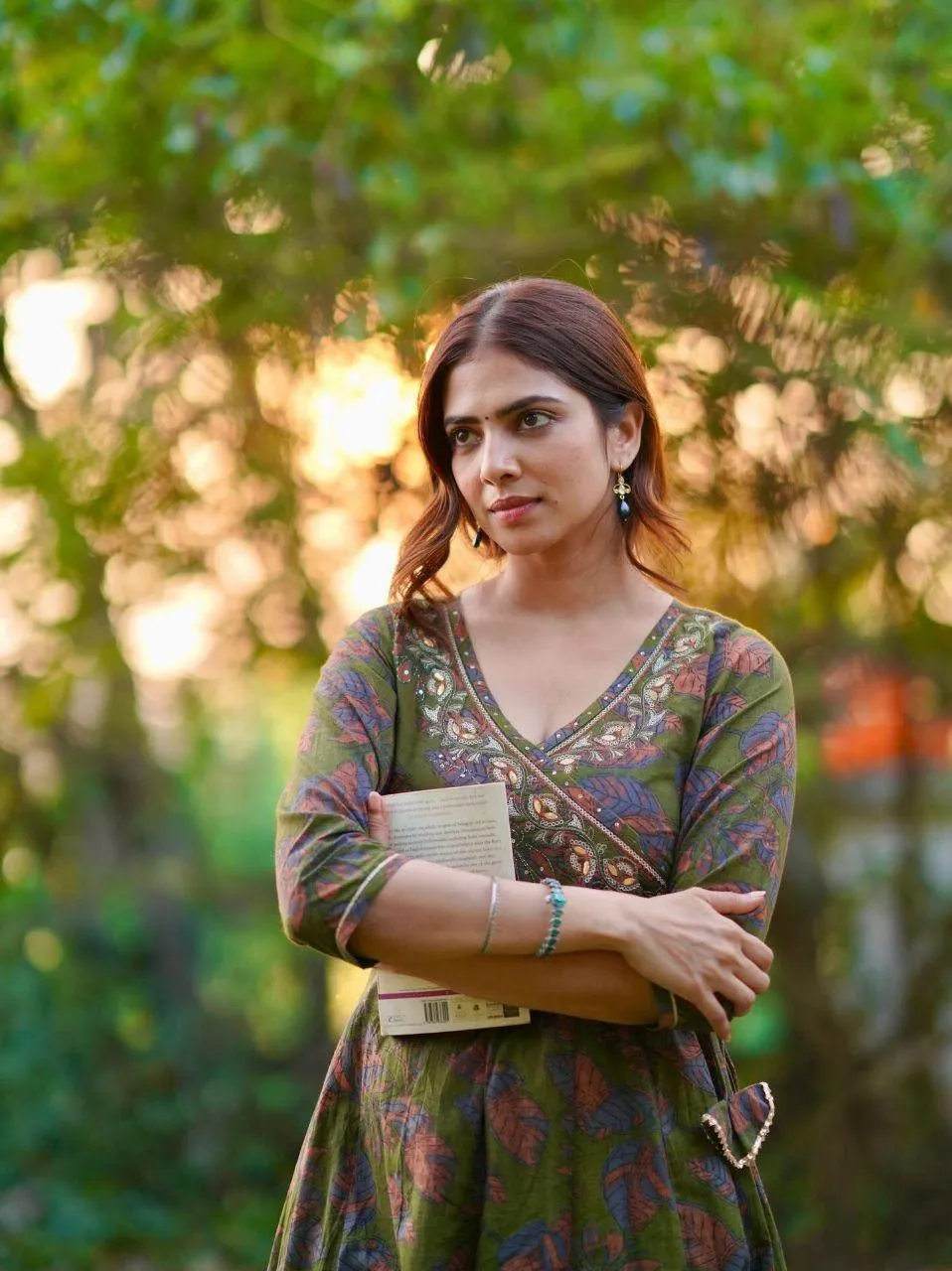 Charming Malavika Mohanan in Green Floral Dress Outdoor