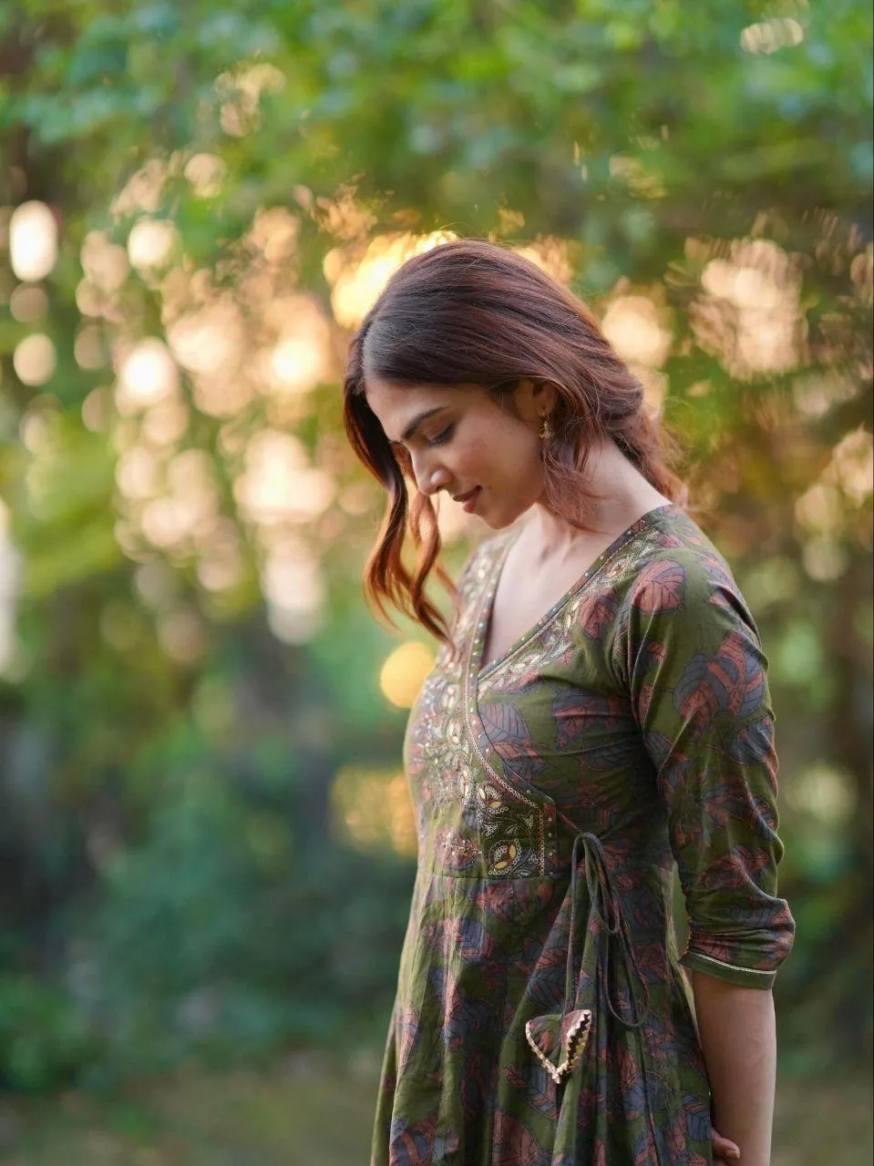 Charming Malavika Mohanan in Olive Green Dress Side Pose