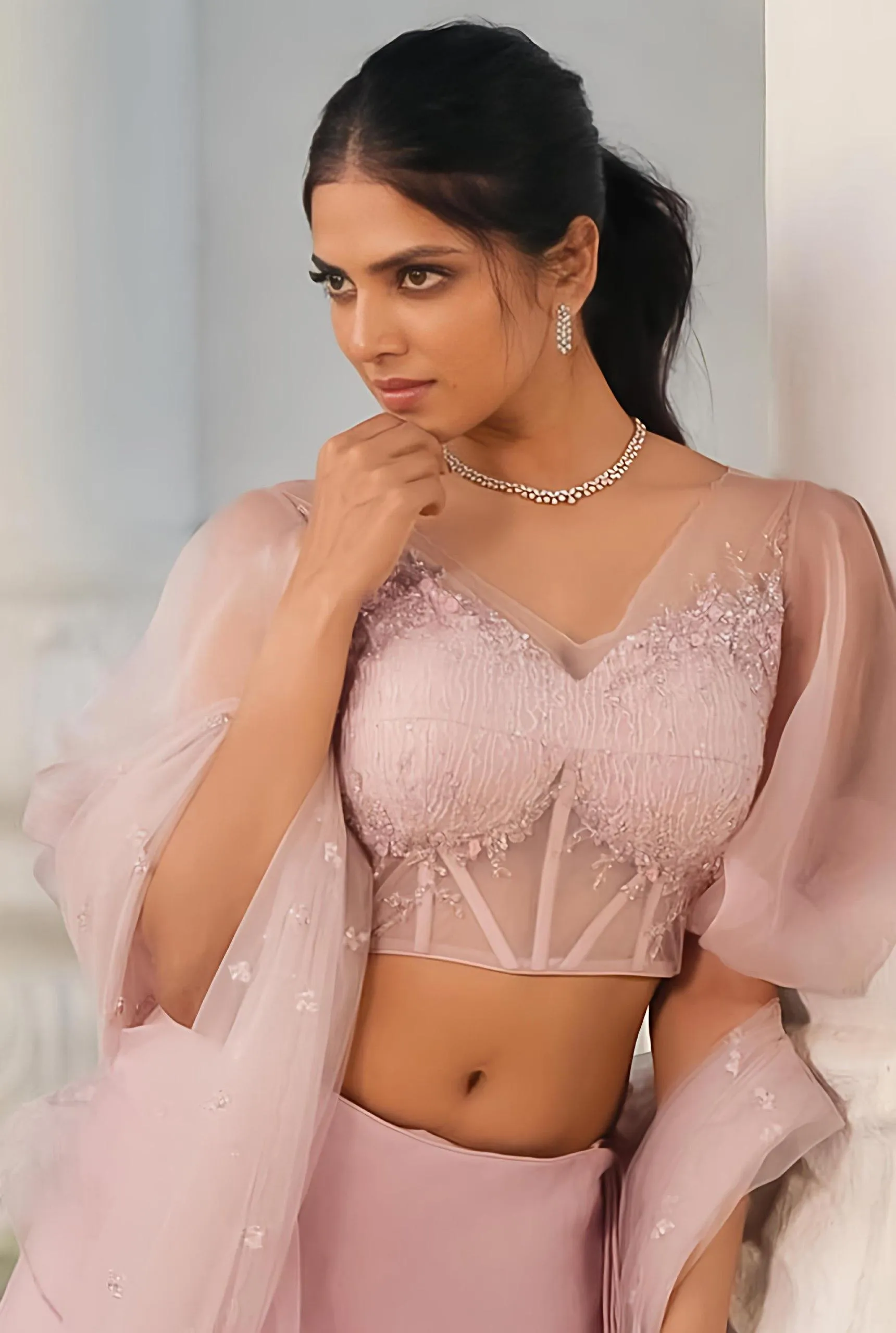 Charming Malavika Mohanan in Pink Lehenga with Stylish Pose