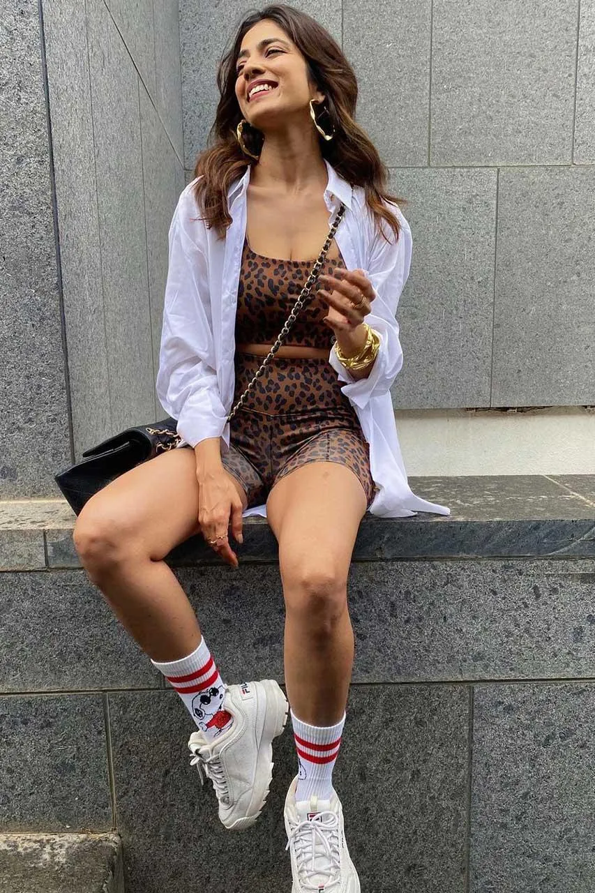 Charming Malavika Mohanan in Shorts Trendy Outdoor Pose