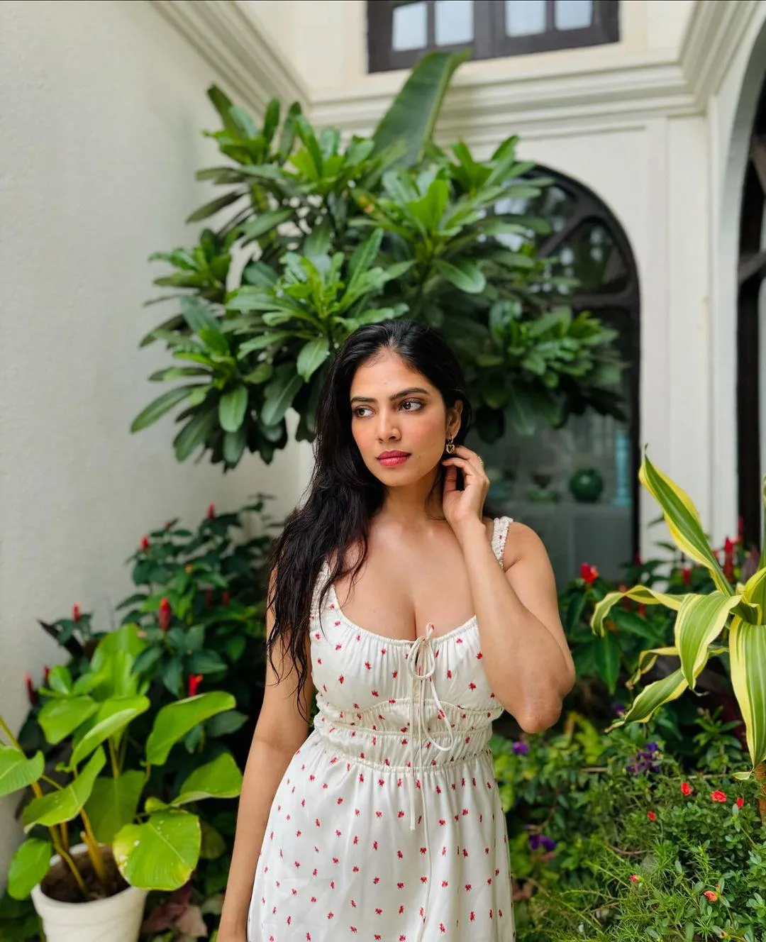 Charming Malavika Mohanan in White Gown Near Greenery
