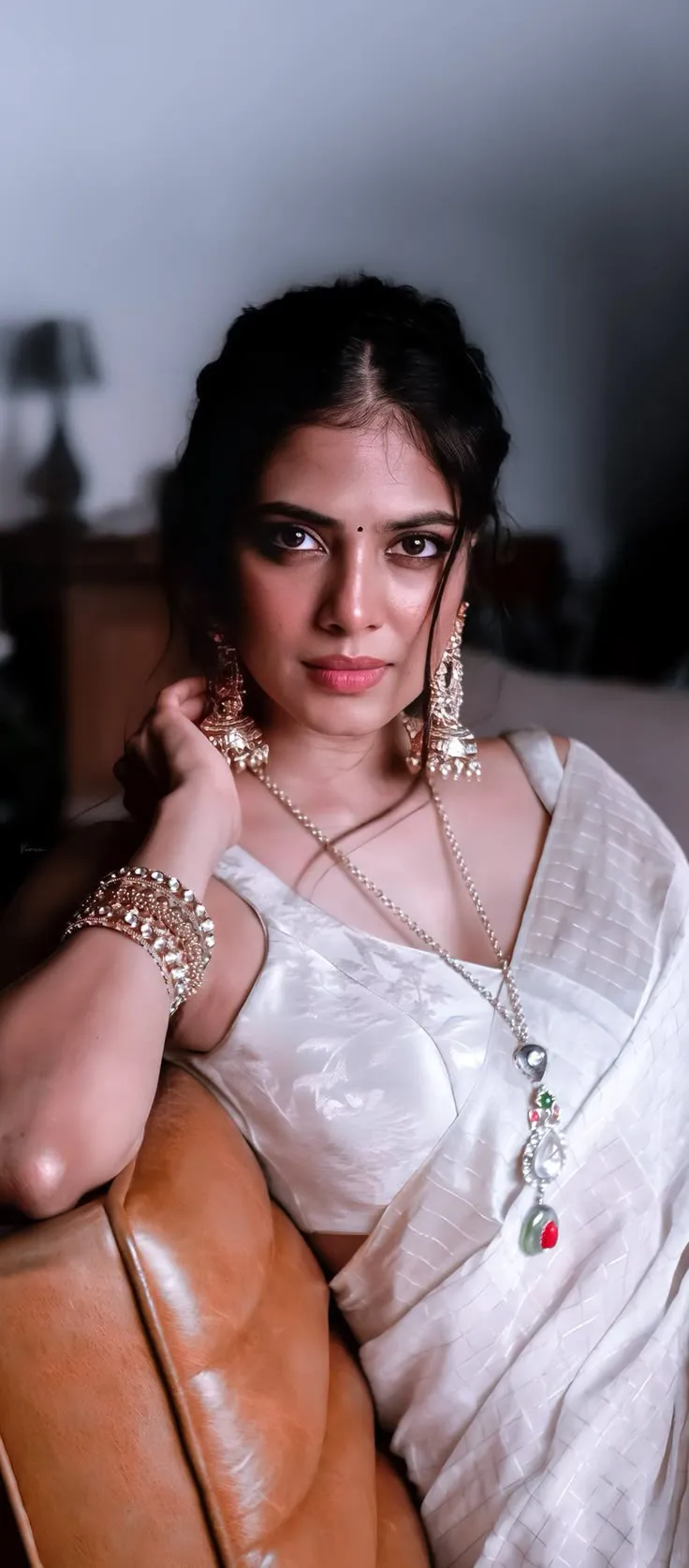 Charming Malavika Mohanan in White Gown Posing Elegantly