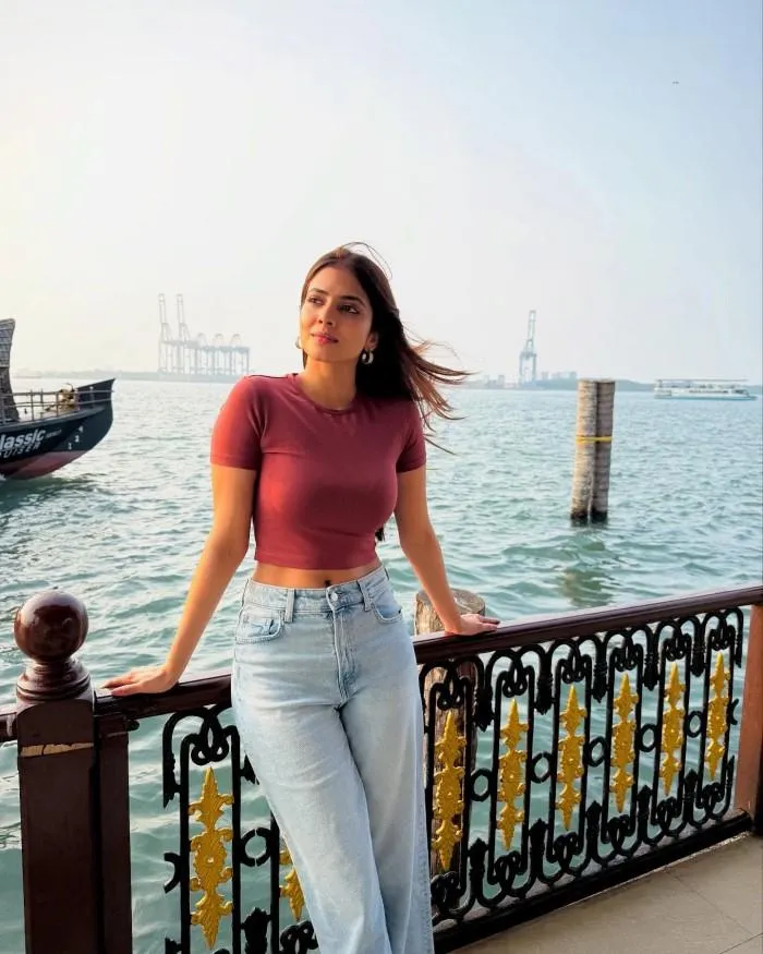 Charming Malavika Mohanan Leaning on Railing with Smile
