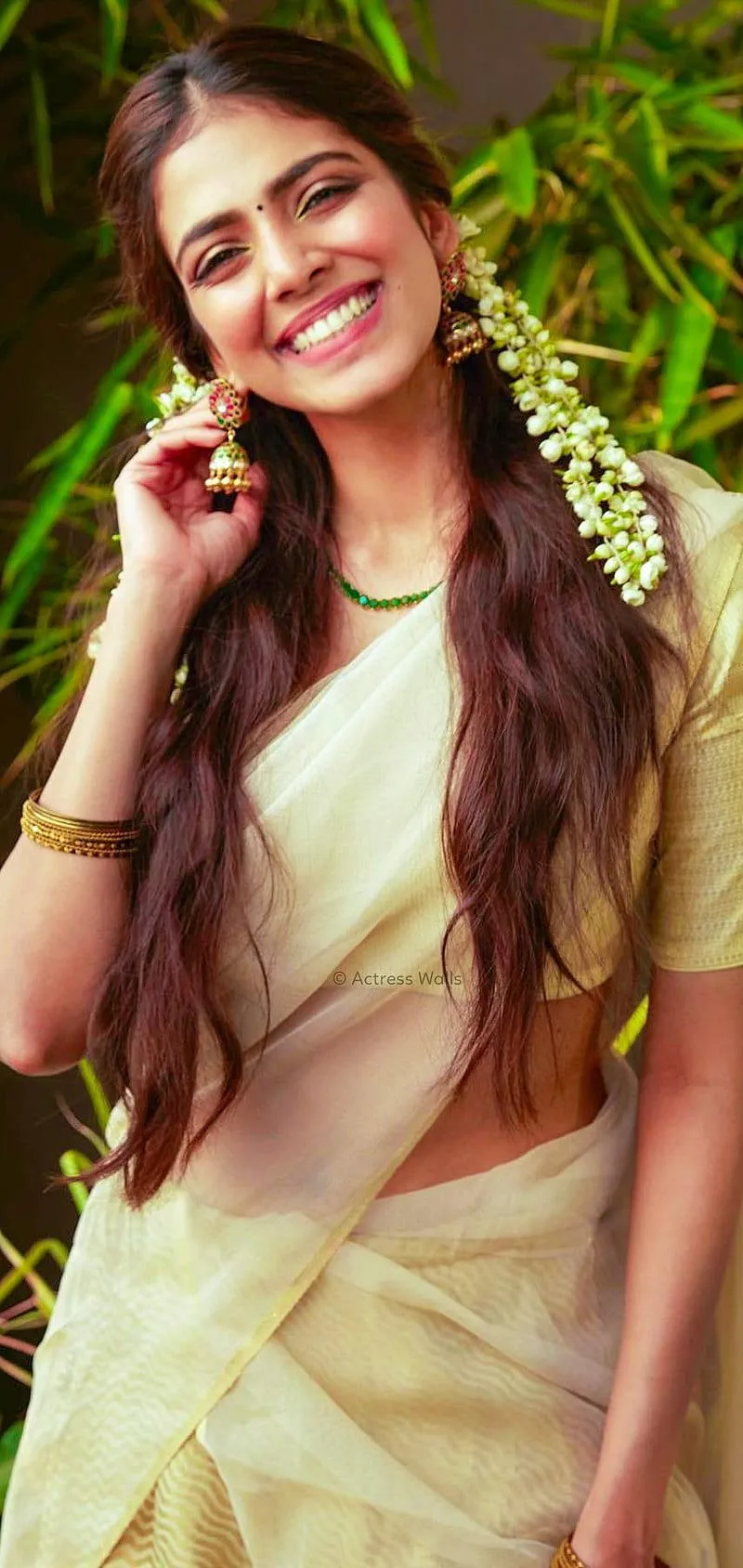 Charming Malavika Mohanan Relaxed Casual Green Dress Look