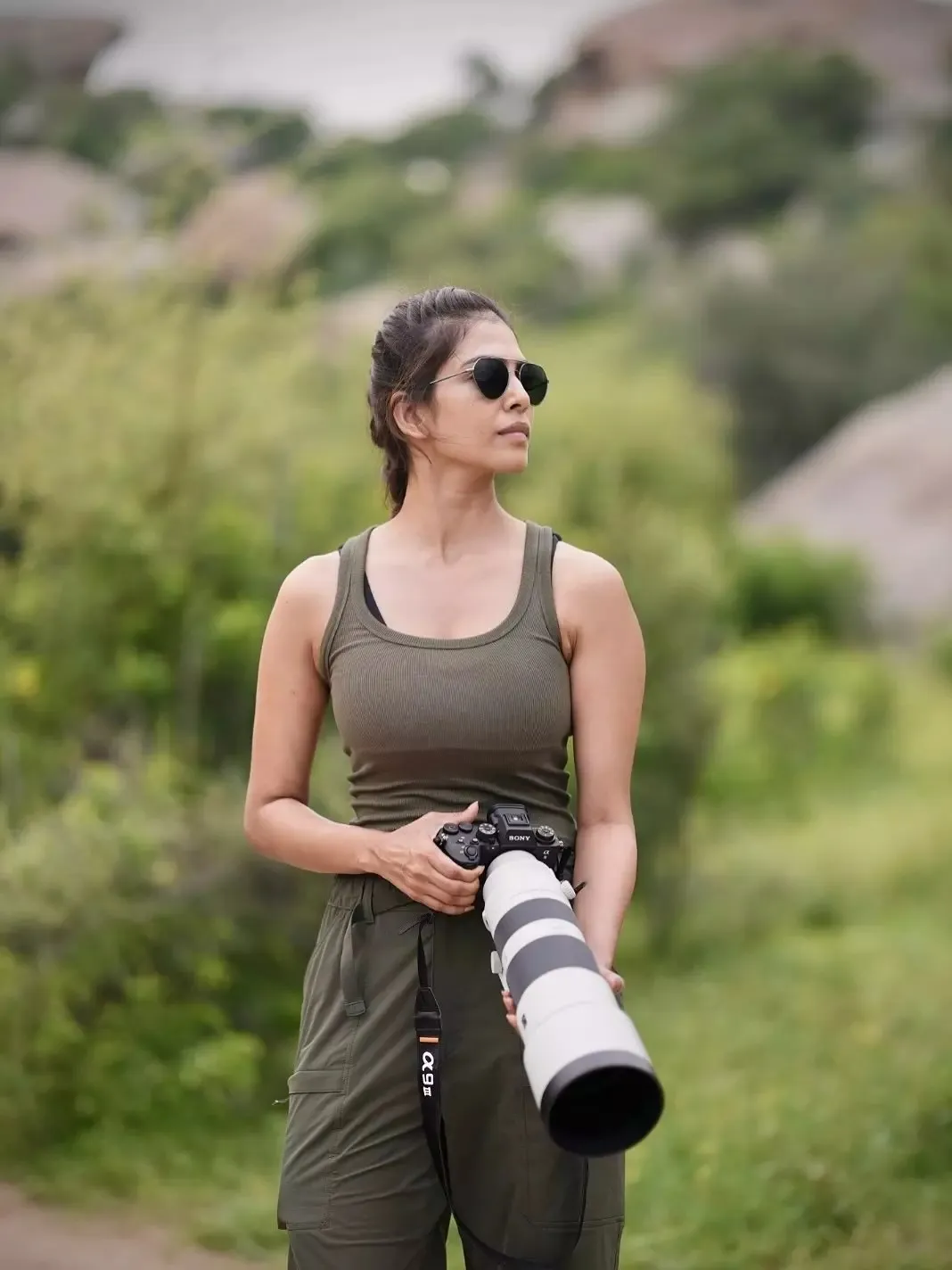 Charming Malavika Mohanan Rests in Sporty Grey Wear Image