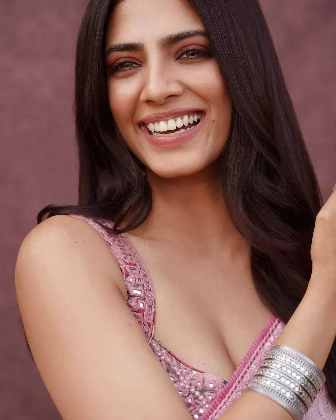 Charming Malavika Mohanan Smiling Brightly in Pink Dress