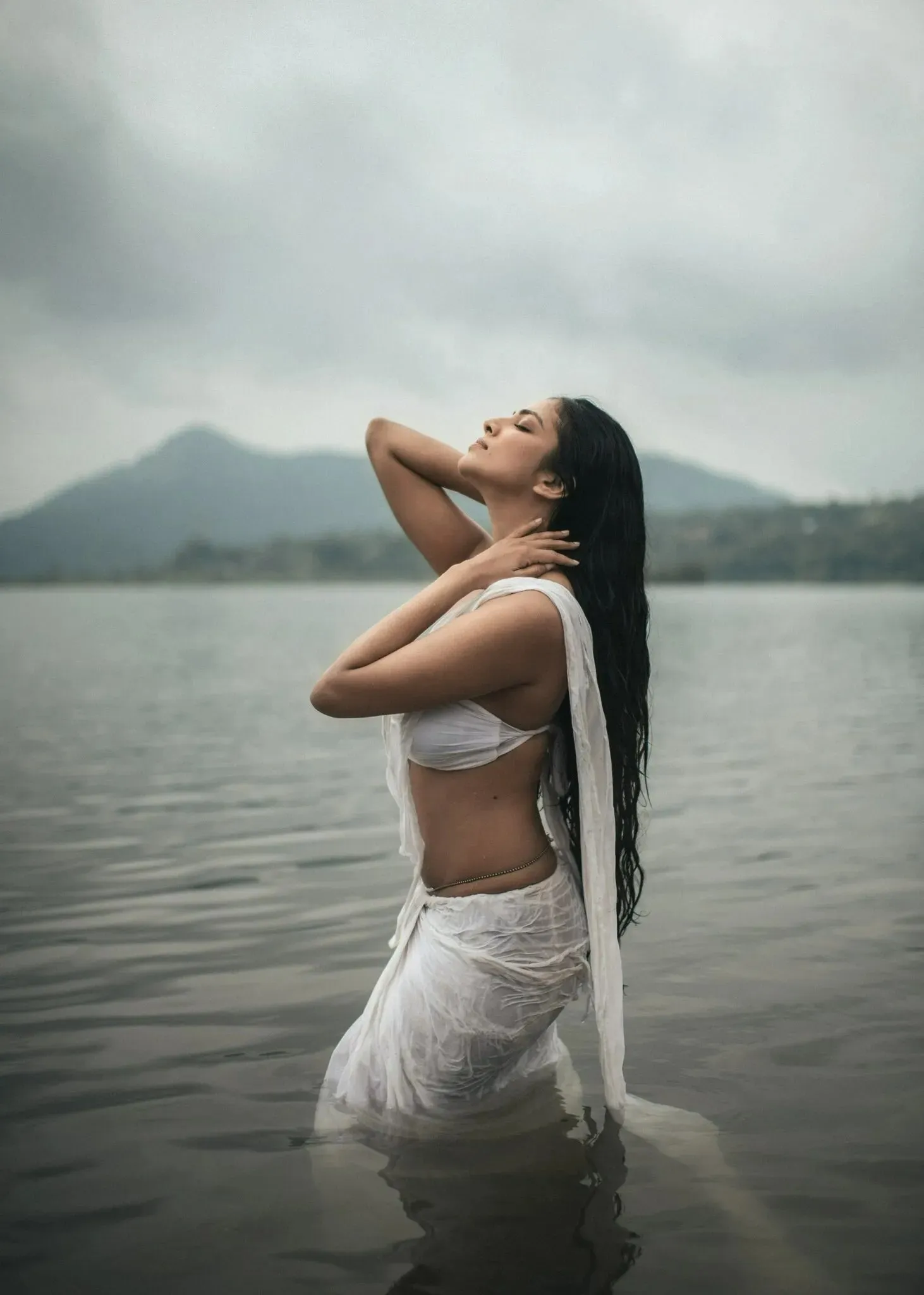 Charming Malavika Mohanan Standing in Water with Calm Look