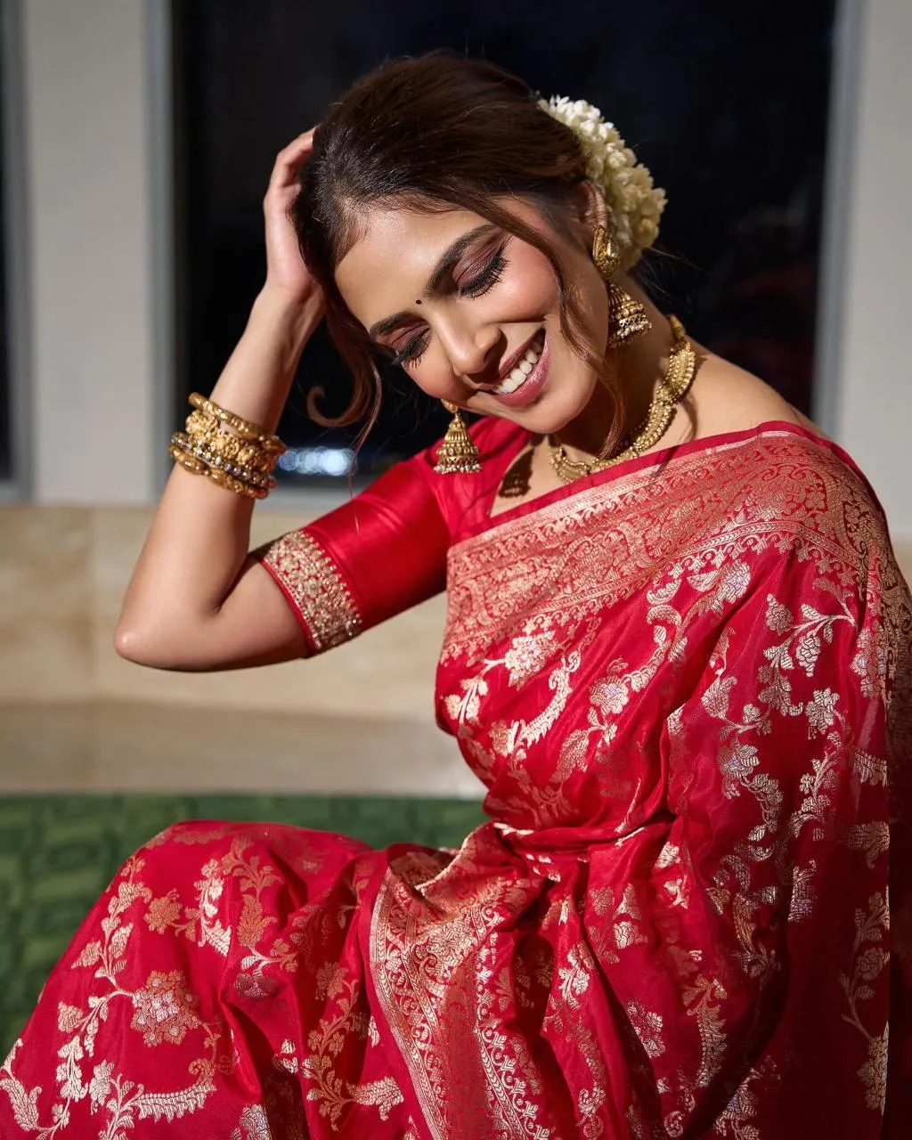 Charming Malavika Mohanan Stunning Pose in Red Gown