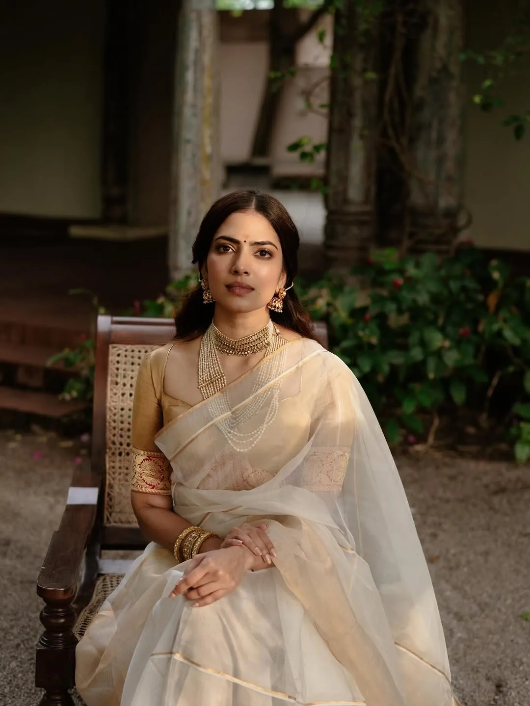Charming Malavika Mohanan Wearing Cream Dress Outdoors Image