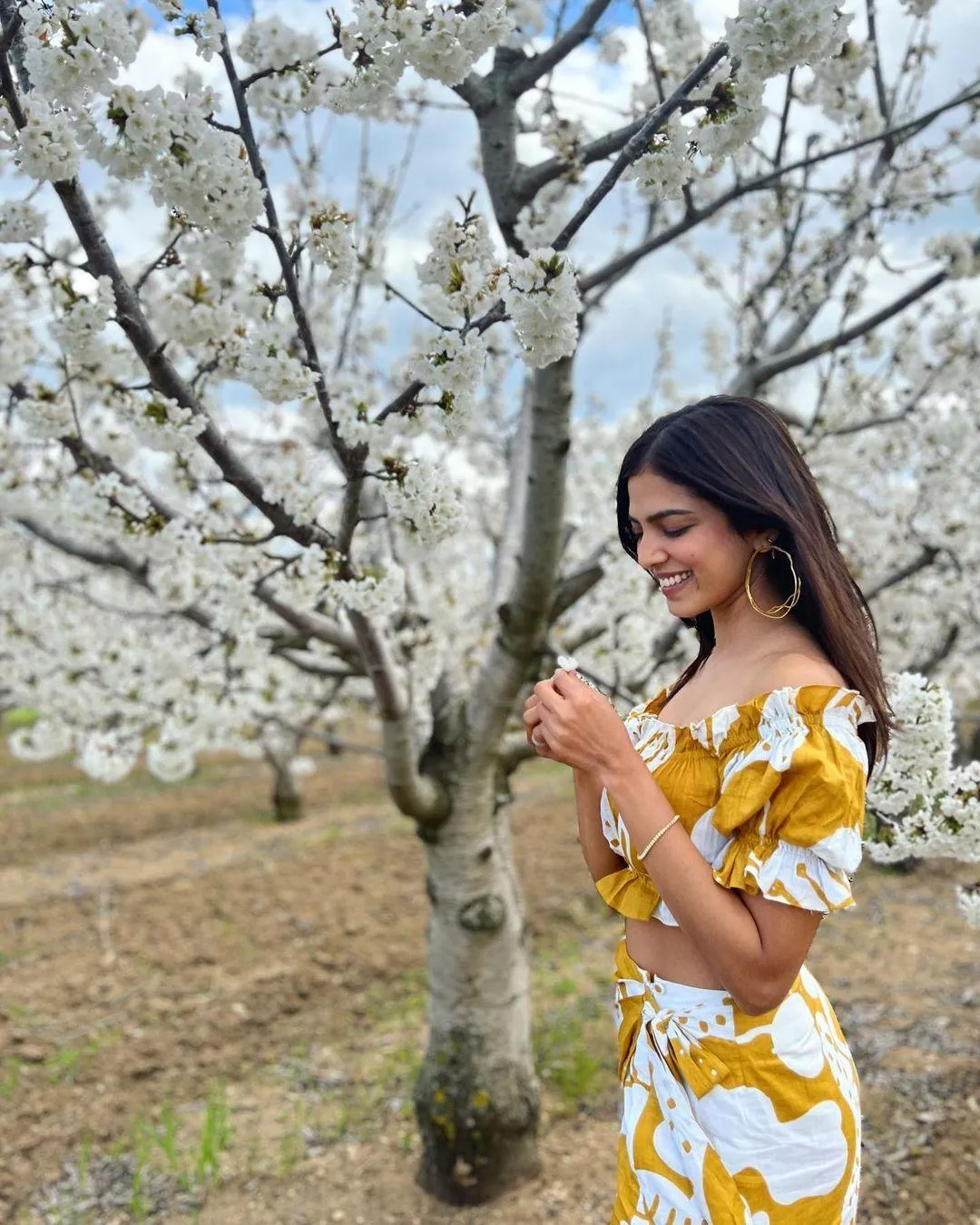 Charming Malavika Mohanan Wearing Elegant Yellow Dress Image