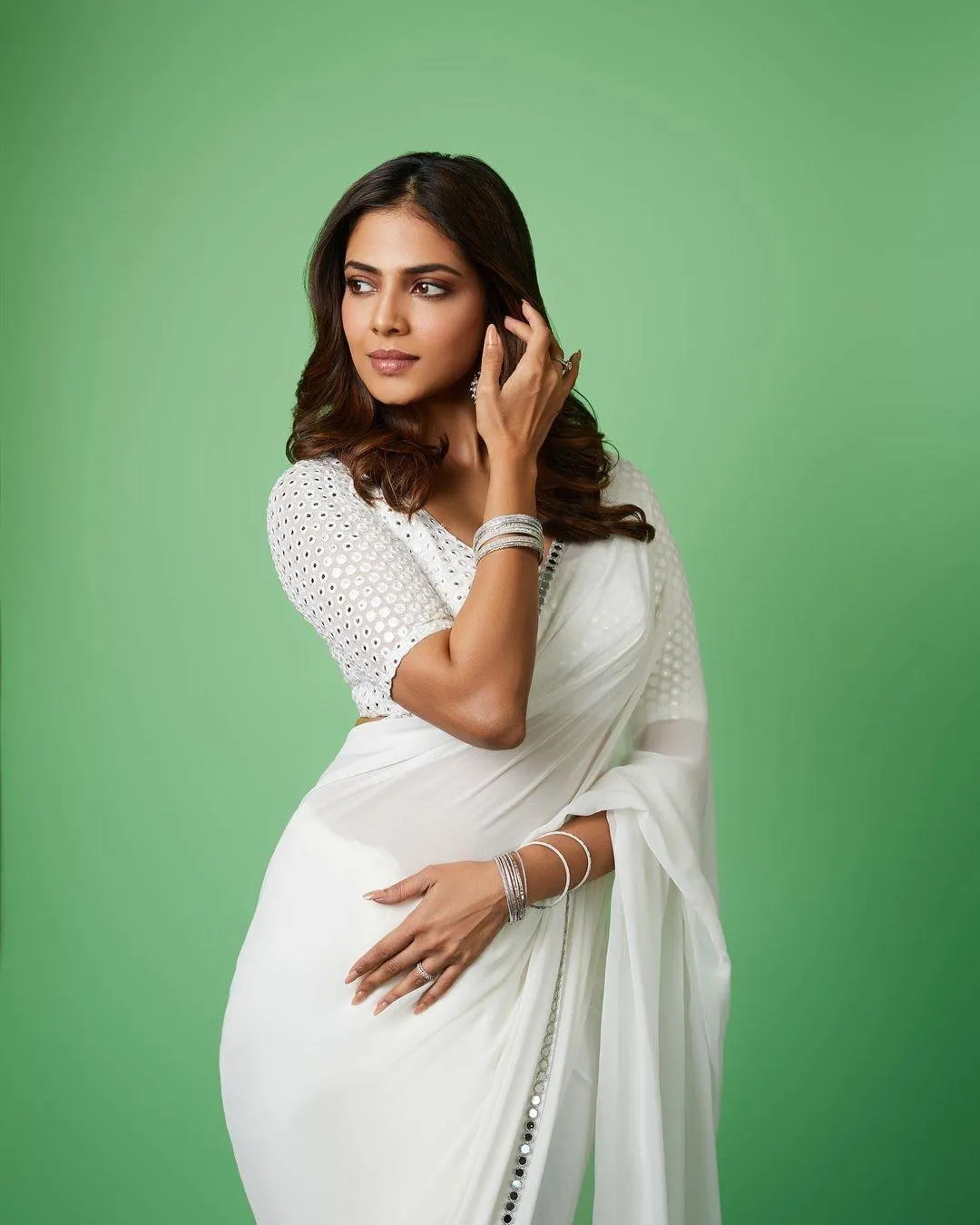 Charming Malavika Mohanan Wearing Green Dress Posing Softly