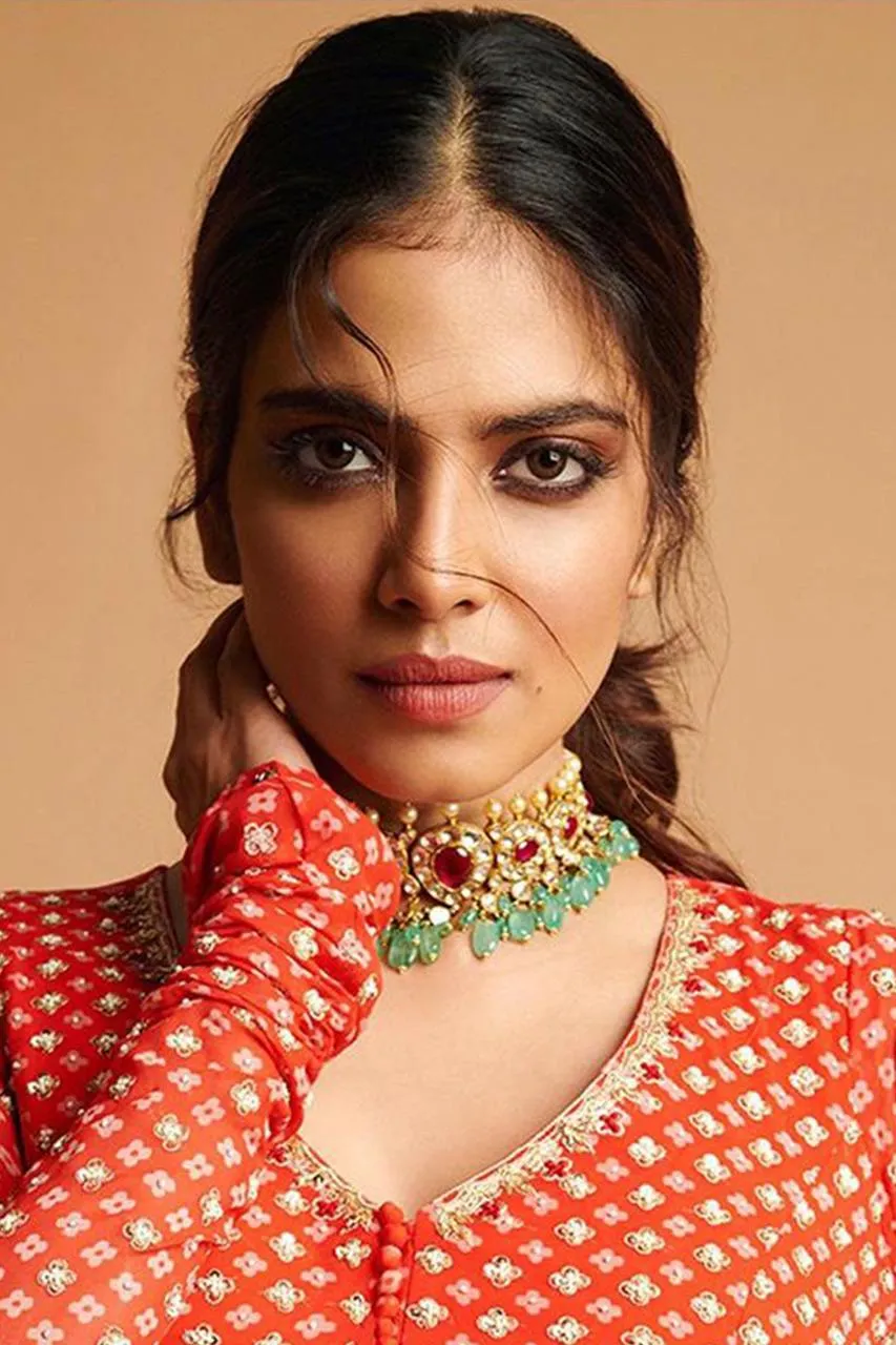 Charming Malavika Mohanan Wearing Traditional Red Dress