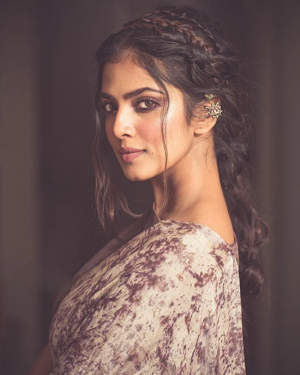 Elegant Pose of Malavika Mohanan Calm Look in Beige Saree