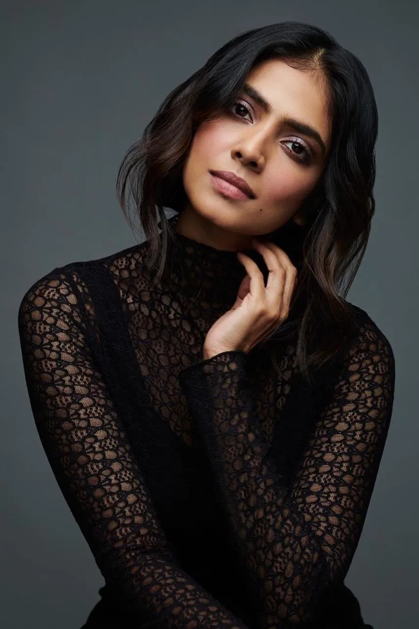 Elegant Pose of Malavika Mohanan Chic Smile in Black Gown