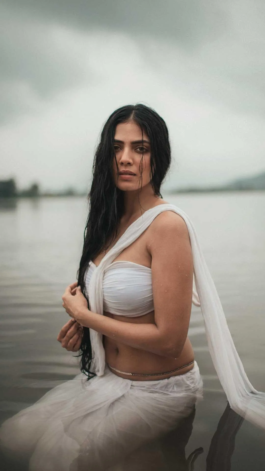 Elegant Pose of Malavika Mohanan Graceful in White Saree