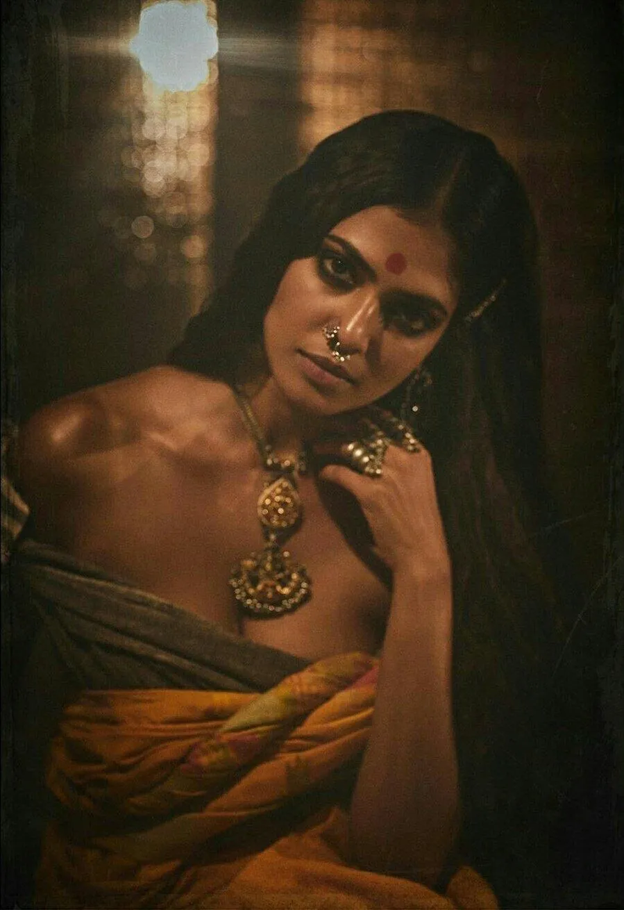 Elegant Pose of Malavika Mohanan Stylish in Golden Gown