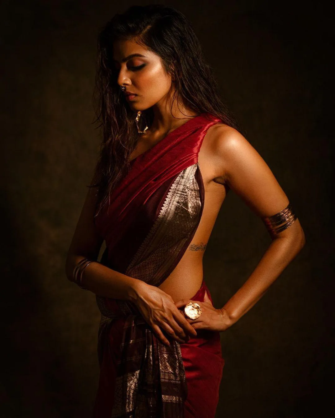 Fashion Photo of Malavika Mohanan Charming Pose in Red Saree