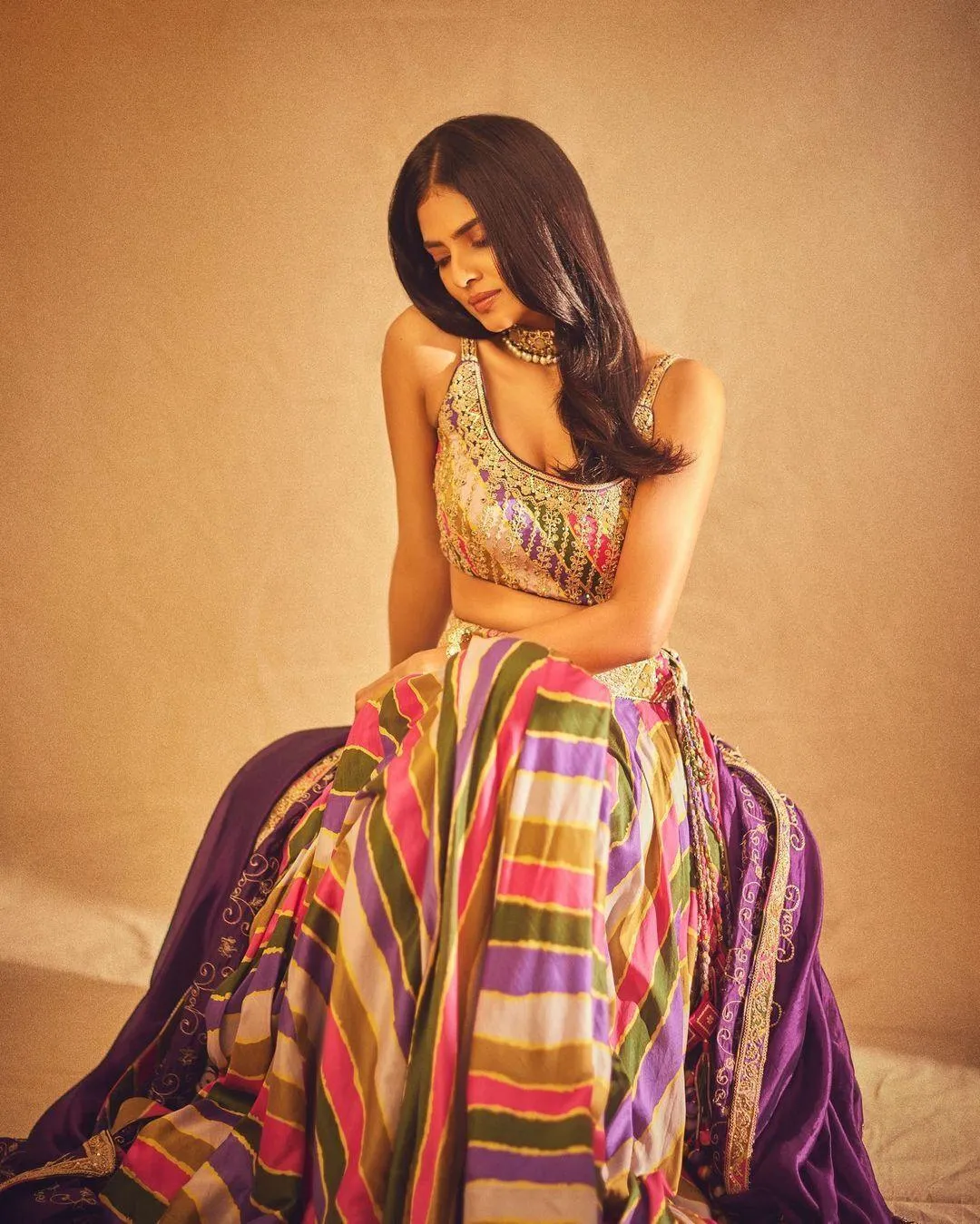 Glamorous Shot of Malavika Mohanan Chic Pose in Striped Gown