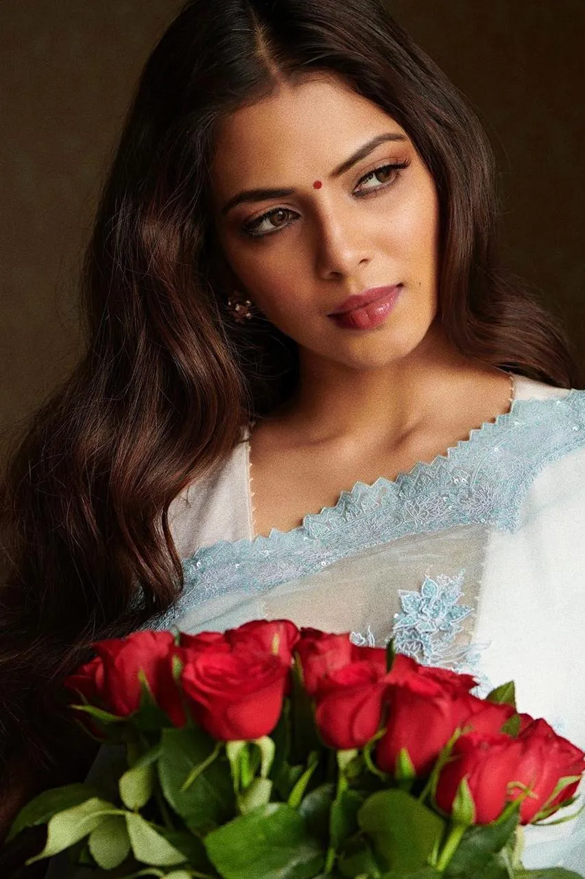 Gorgeous Malavika Mohanan Holding Roses in Soft Light Image