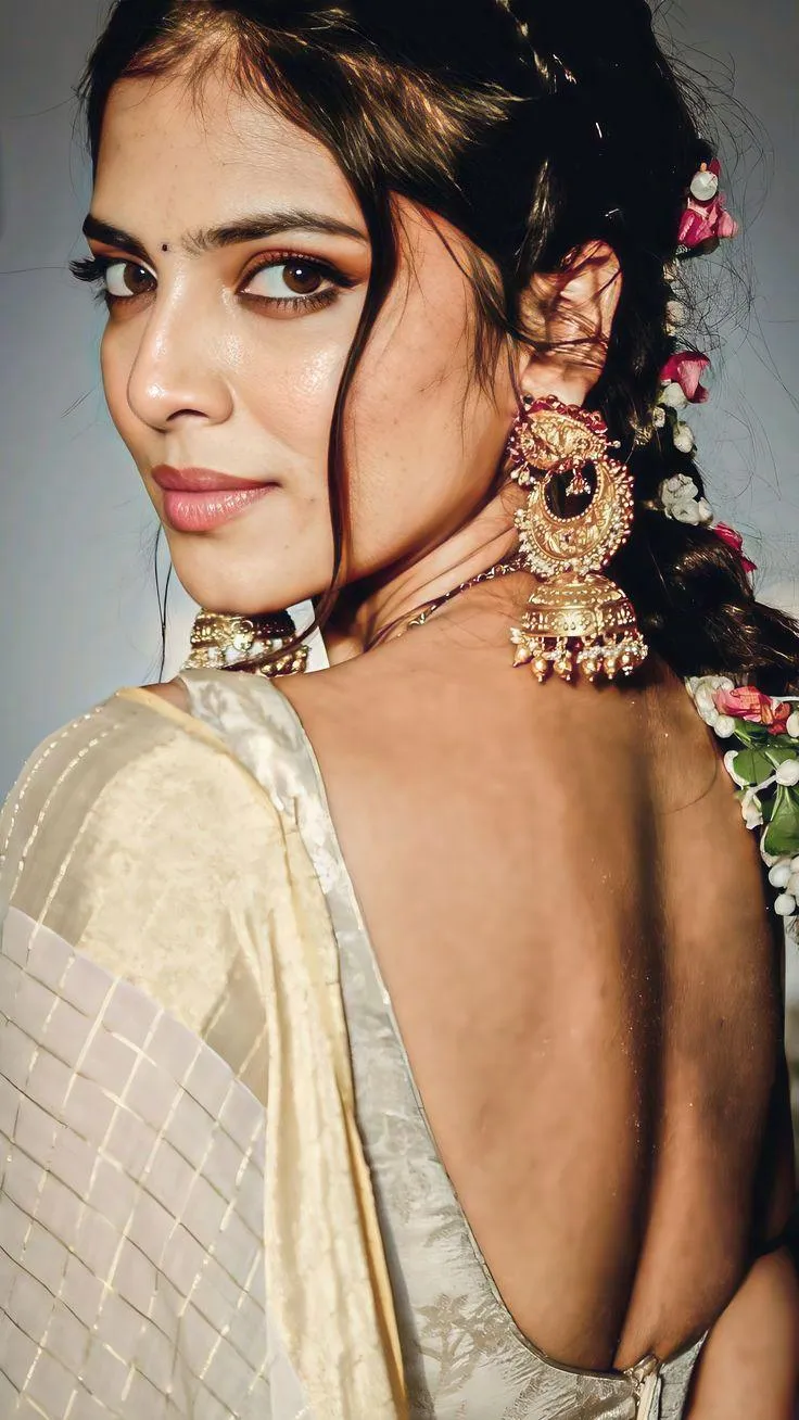 Gorgeous Malavika Mohanan in Cream Saree Elegant Back Pose