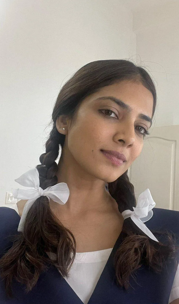 Gorgeous Malavika Mohanan in Simple White Dress Natural Pose
