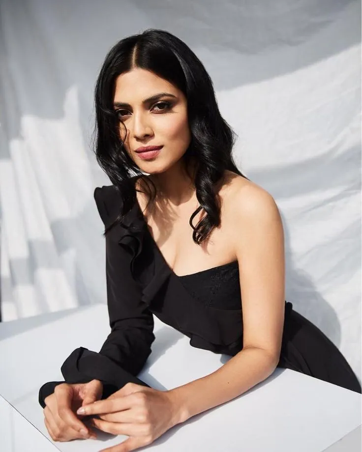 Gorgeous Malavika Mohanan in Sleeveless Black Gown Posing