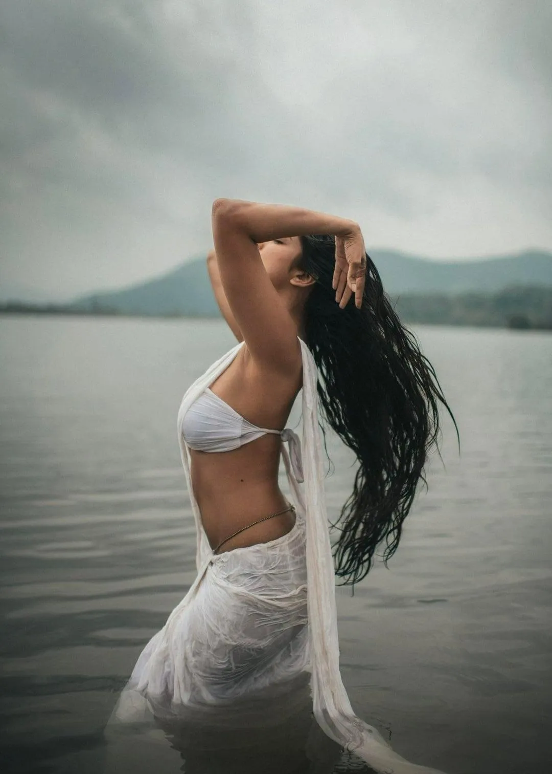 Gorgeous Malavika Mohanan in White Saree Ocean Backdrop
