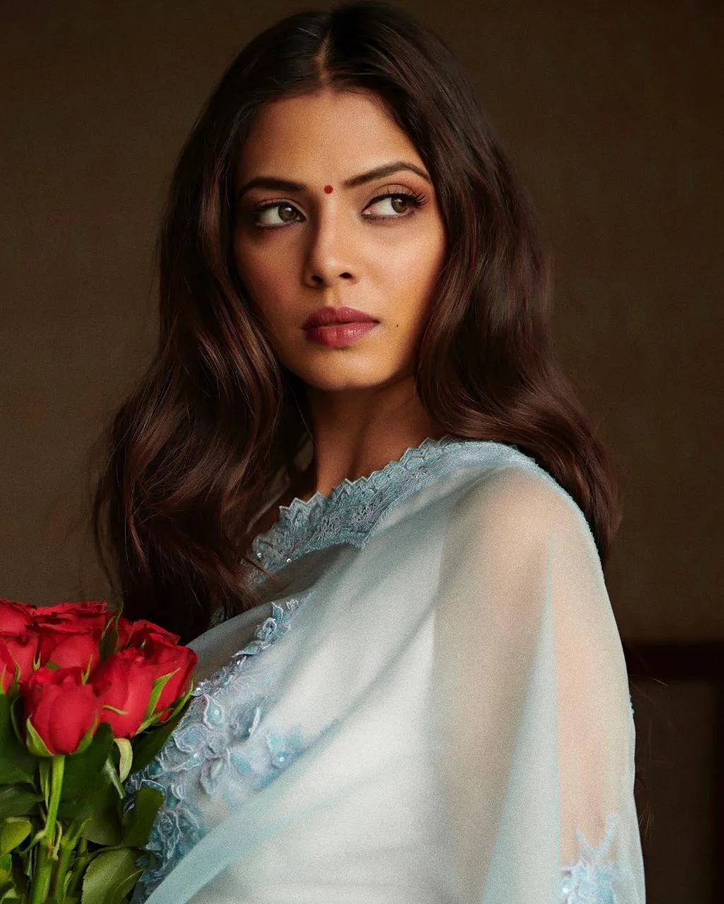 Gorgeous Malavika Mohanan in White Saree with Red Flowers