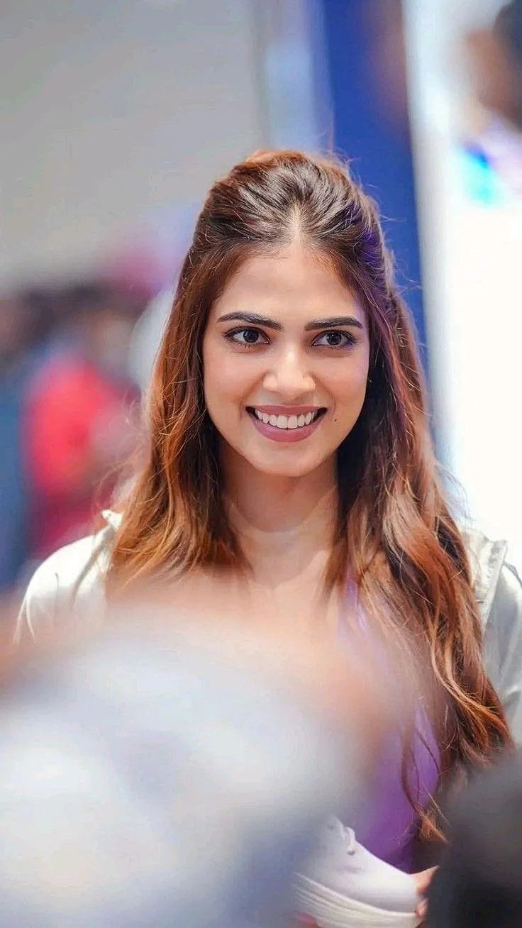 Gorgeous Malavika Mohanan Smiling Wearing Casual White Dress