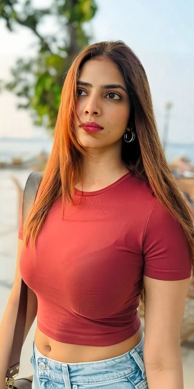 Gorgeous Malavika Mohanan Wearing Casual Red Crop Top Image