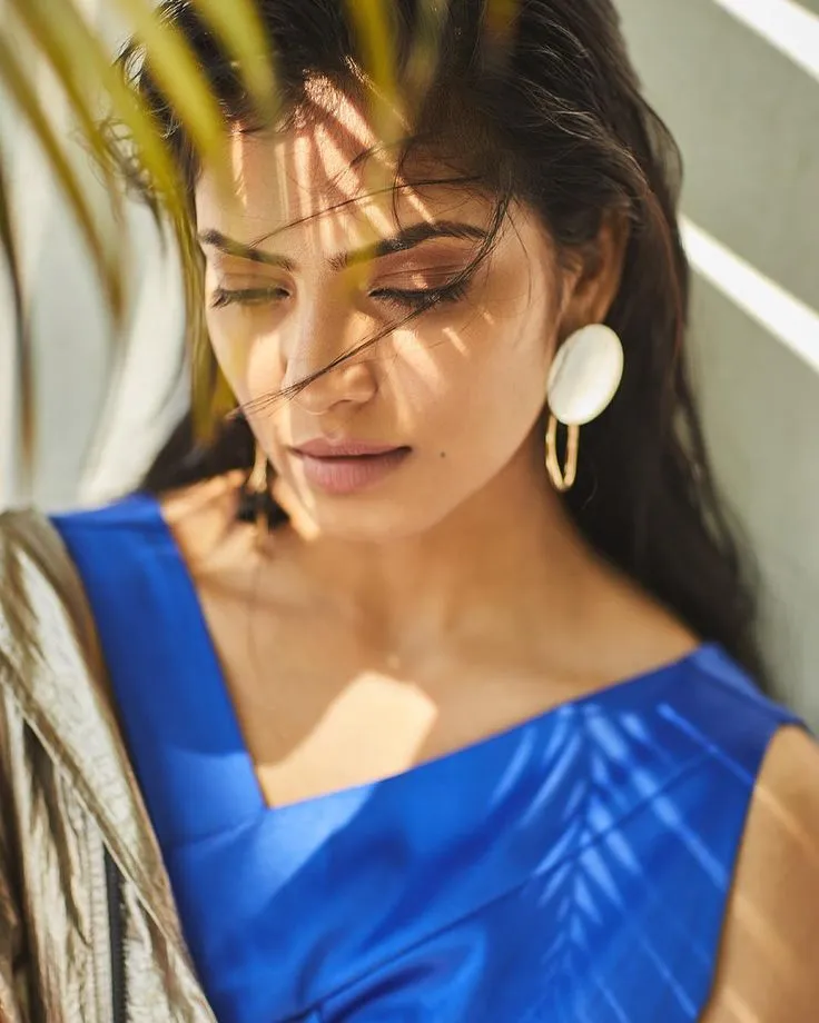Handsome Malavika Mohanan in Blue Gown Smiling Brightly