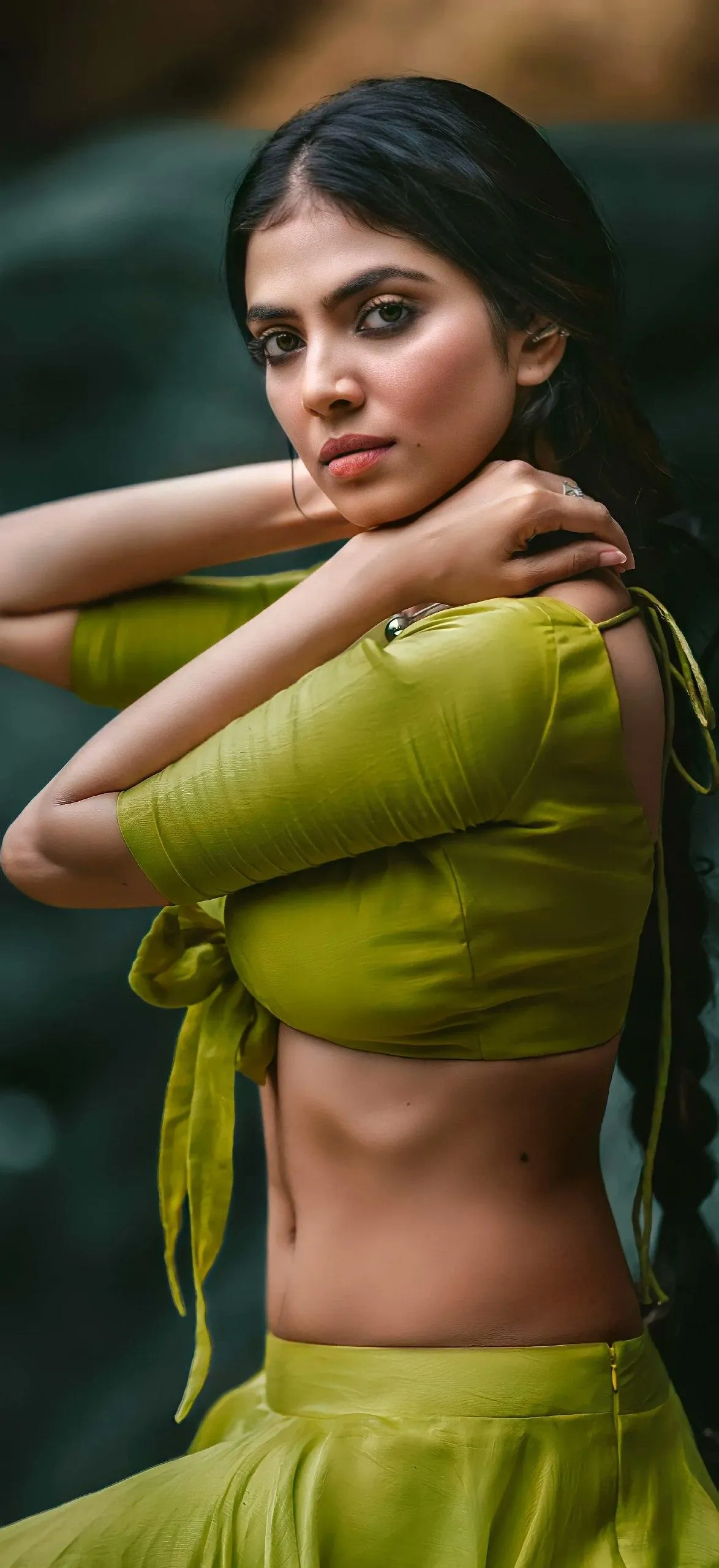 Handsome Malavika Mohanan in Green Blouse Posing Sideways