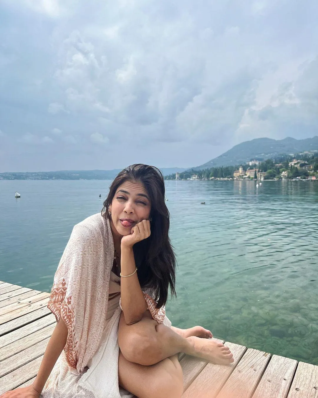 Handsome Malavika Mohanan Relaxing by the Seaside Wallpaper