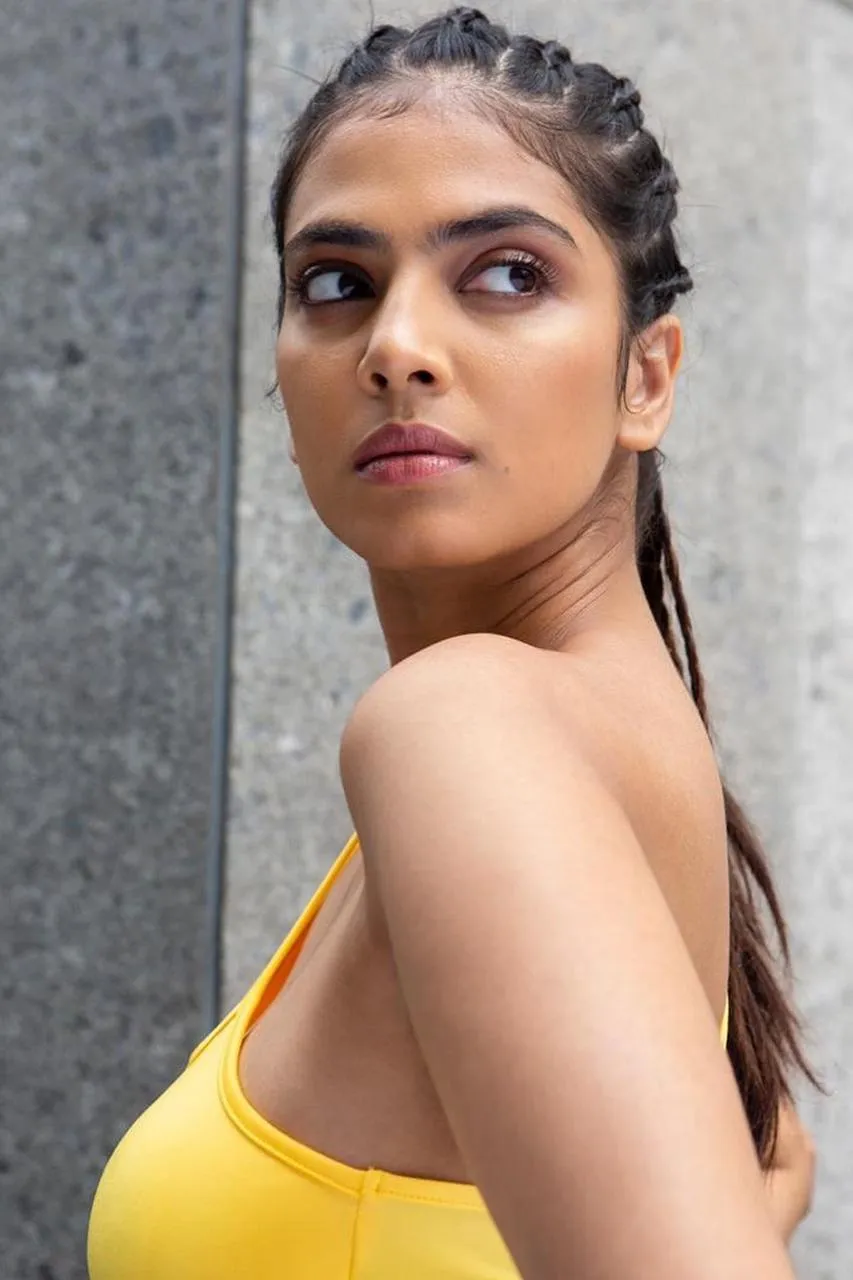 Handsome Malavika Mohanan Wearing Yellow Top Intense Look