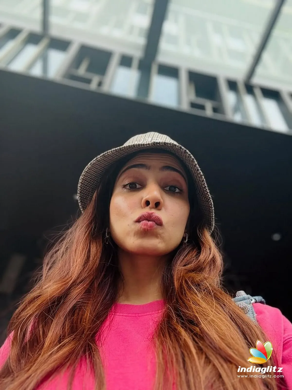 Hot Malavika Mohanan in Pink Dress Candid Expression Image