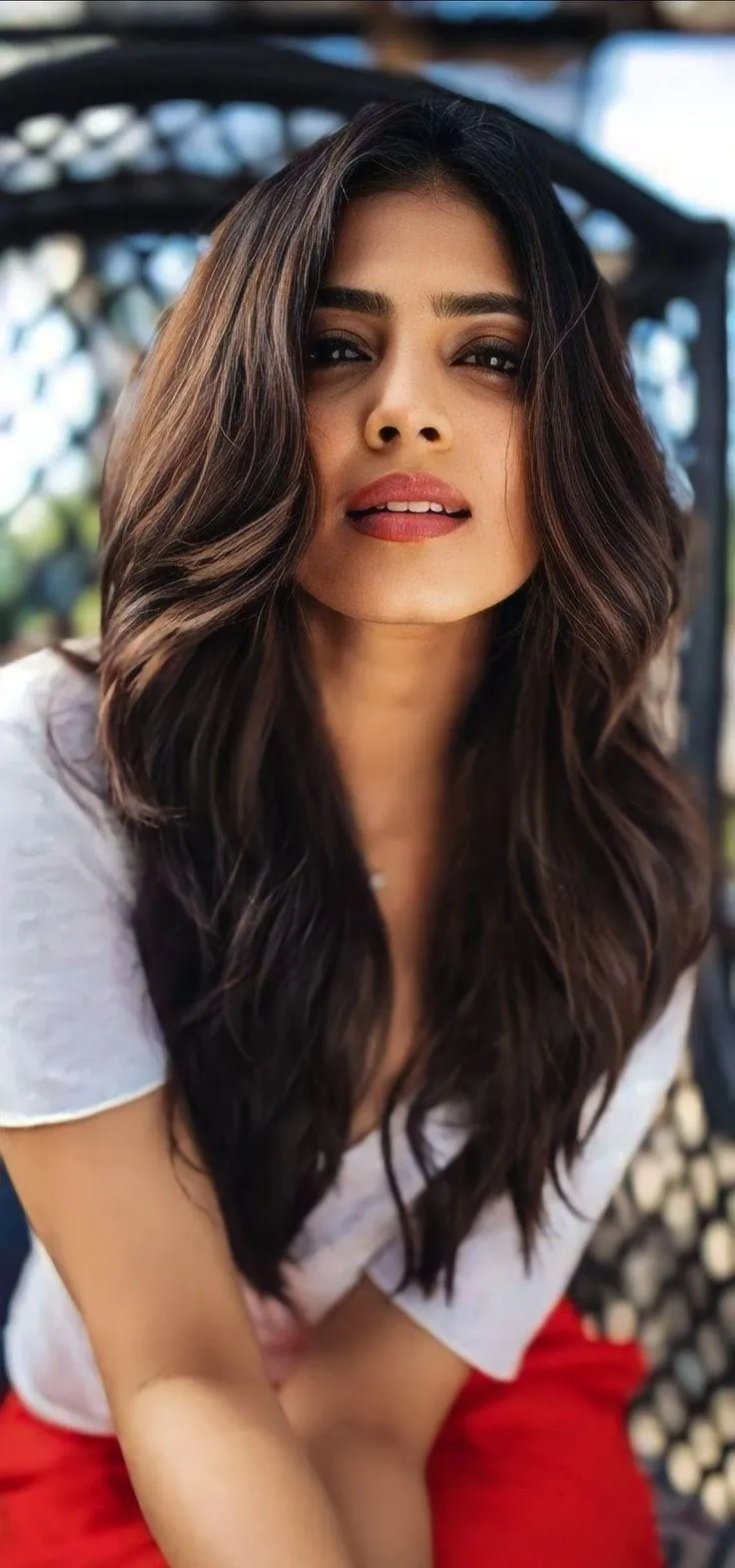 Hot Malavika Mohanan in White Top Casual Sitting Outdoor