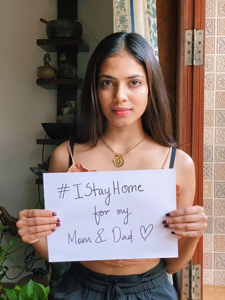 Hottie Malavika Mohanan Holding Sign Board Indoor Photo
