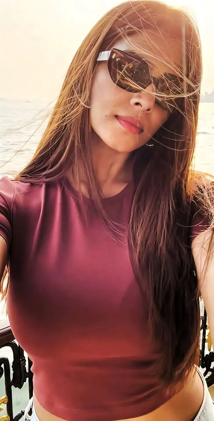 Hottie Malavika Mohanan in Maroon Top with Sunglasses Pose