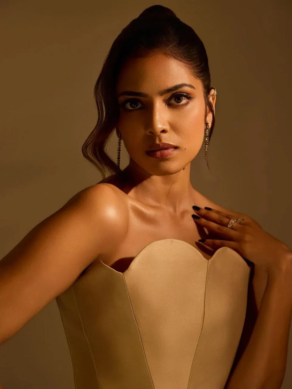 Hottie Malavika Mohanan in Strapless Beige Gown Posing Hot