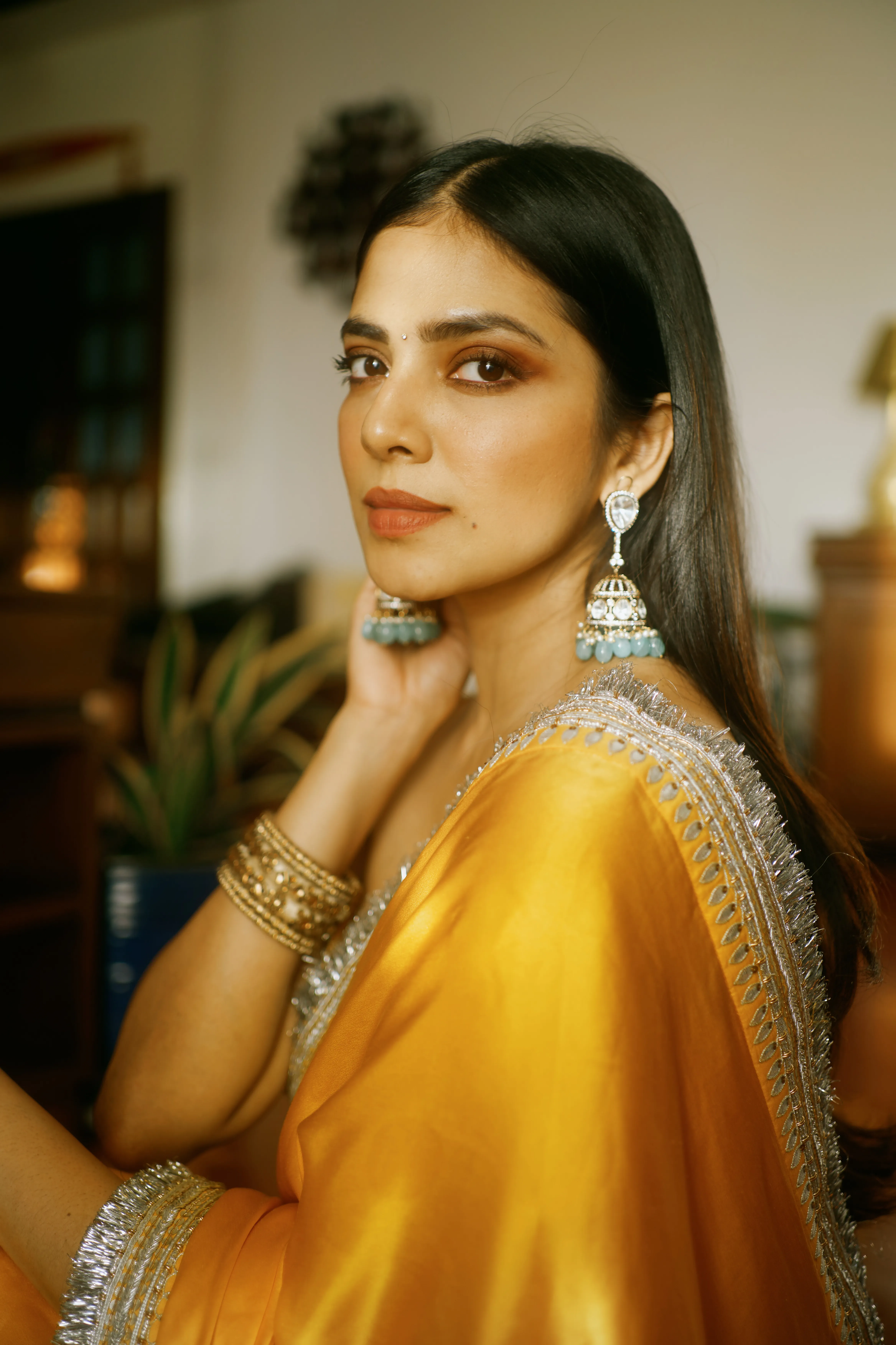 Hottie Malavika Mohanan Shines in Gold Traditional Wallpaper
