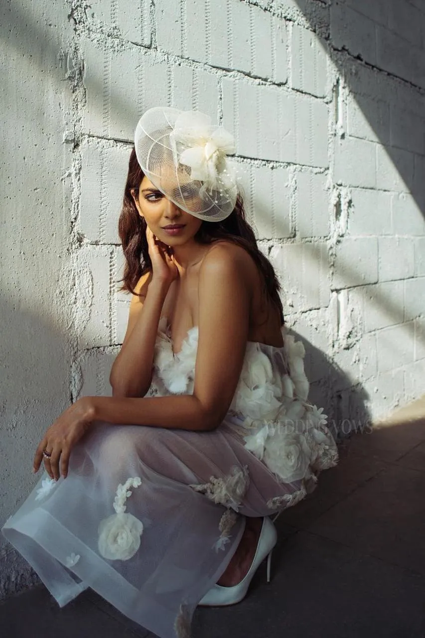 Malavika Mohanan Elegant in White Gown with Beachside View