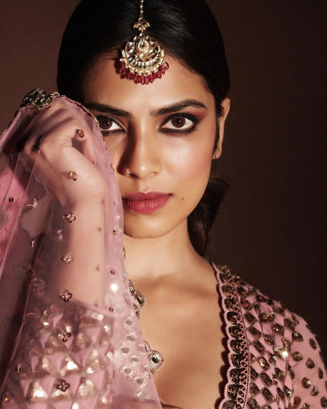Malavika Mohanan in Hottie Pink Saree with Bold Eyes Picture