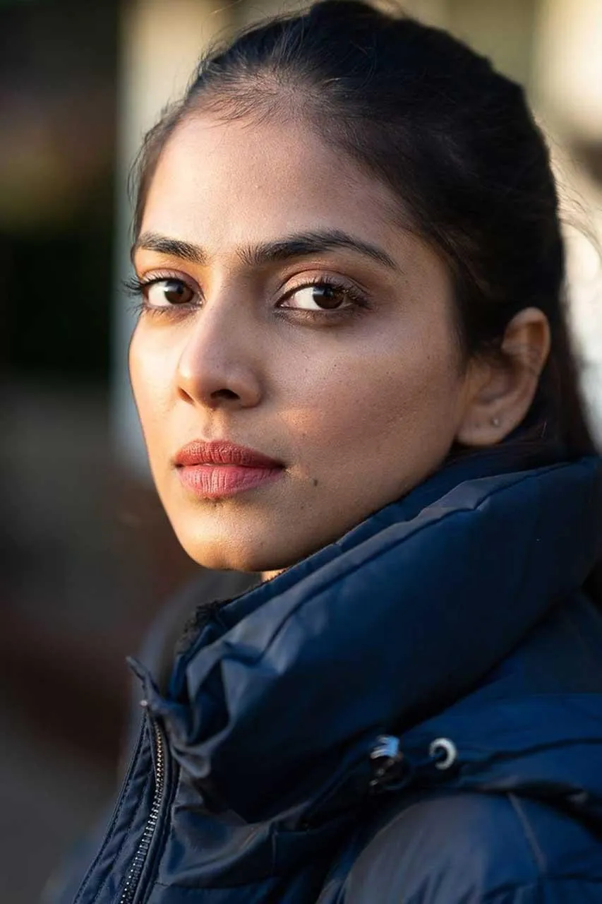 Malavika Mohanan Looking Stunning in Blue Outdoor Coat Image