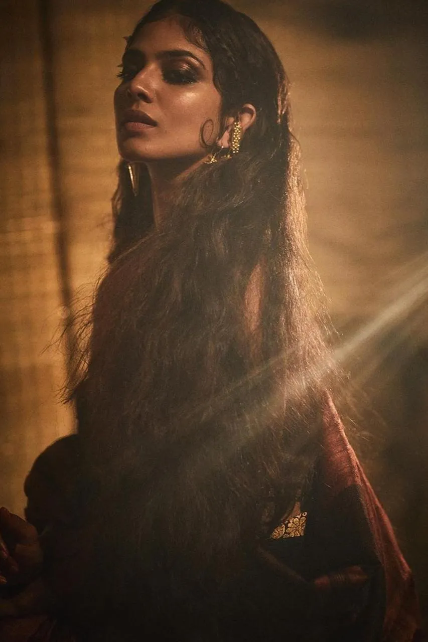 Malavika Mohanan Posing in Golden Light with Artistic Vibe