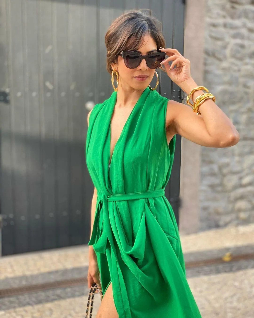 Malavika Mohanan Posing in Green Outfit with Outdoor Charm
