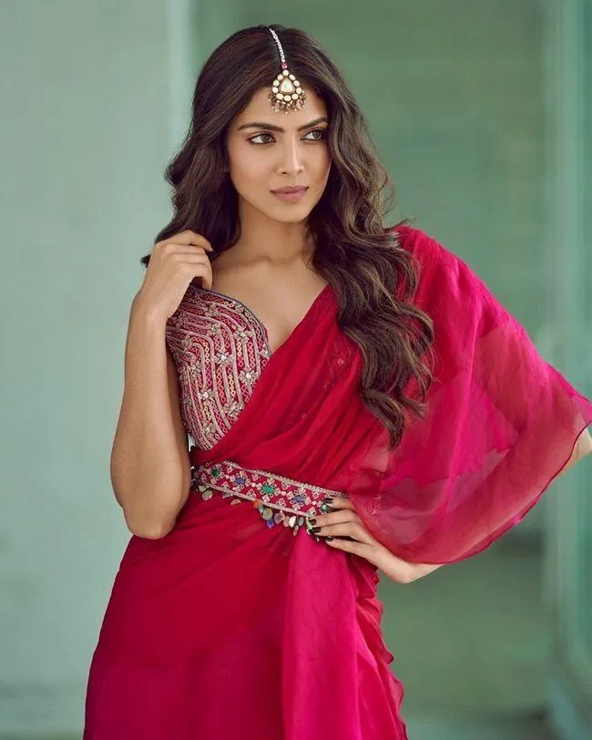 Malavika Mohanan Smiles Wearing Red Dress Outdoors Image